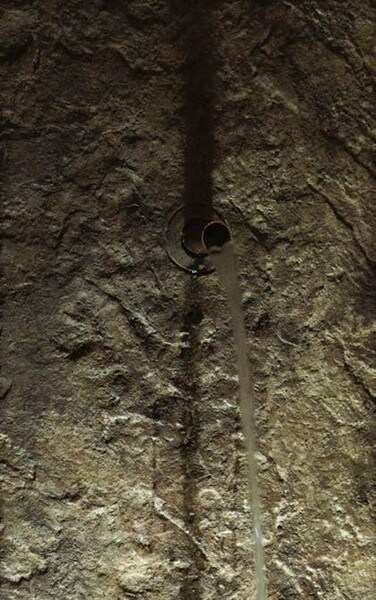 Close Up Piped Rock Face Single Spout Fountain masterpiece of art